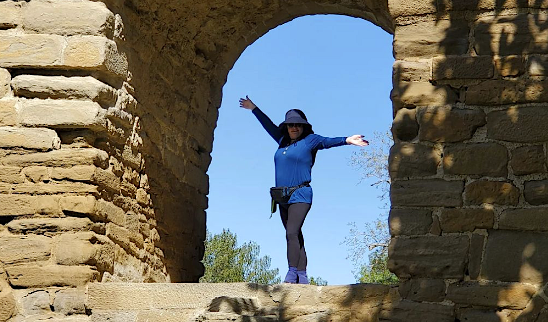 standing under arch