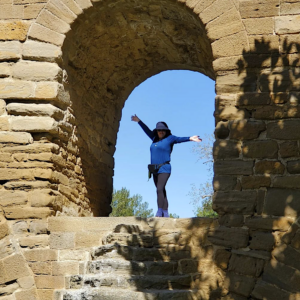 standing under arch